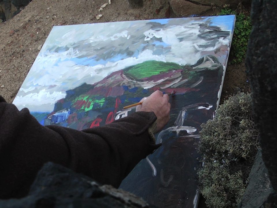 Frame from the Marco Luccio documentary — the artist painting outdoors, Pinnacles scene